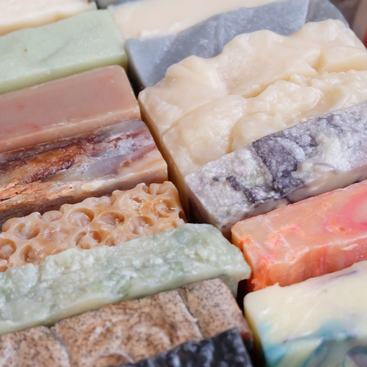 A colourful mosaic of handmade soap bars in many natural shades